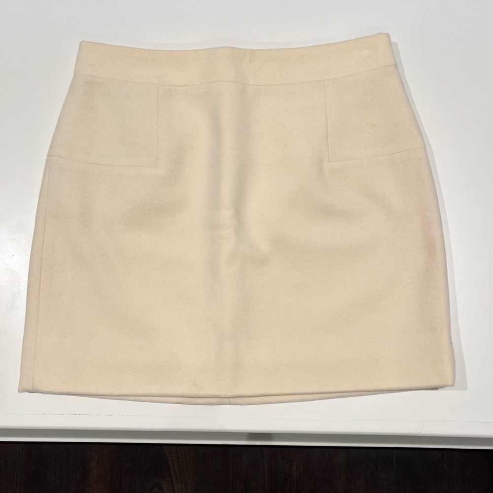 JCrew size 6 cream colored wool mini skirt.